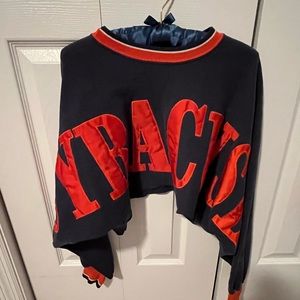Cropped long sleeve custom sweatshirt. Orange Syracuse embroidered across shirt